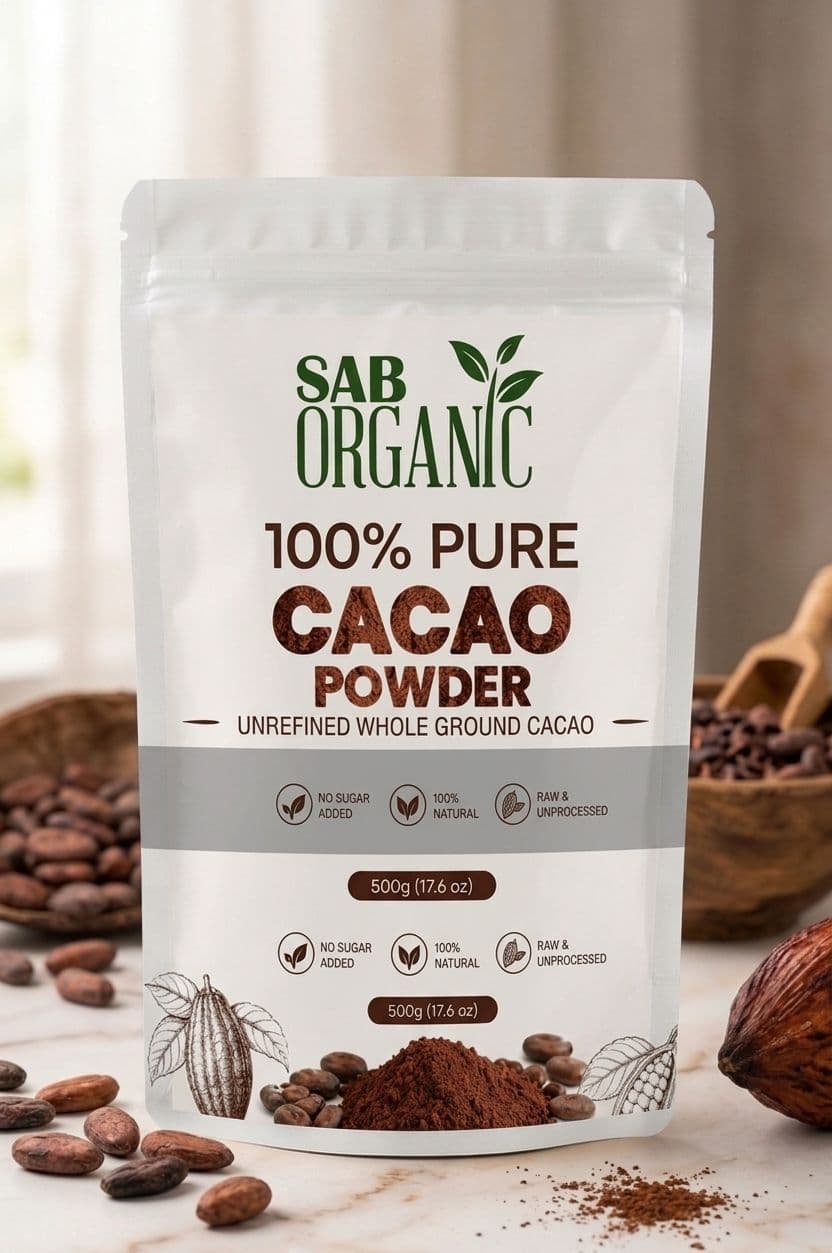 SAB Organic 100% Pure Cacao Powder 500g pouch beside cacao beans and powder.